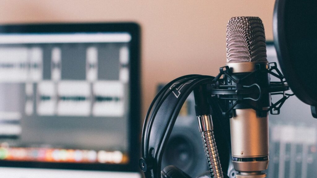 Podcast setup in a room with computer and mic setup